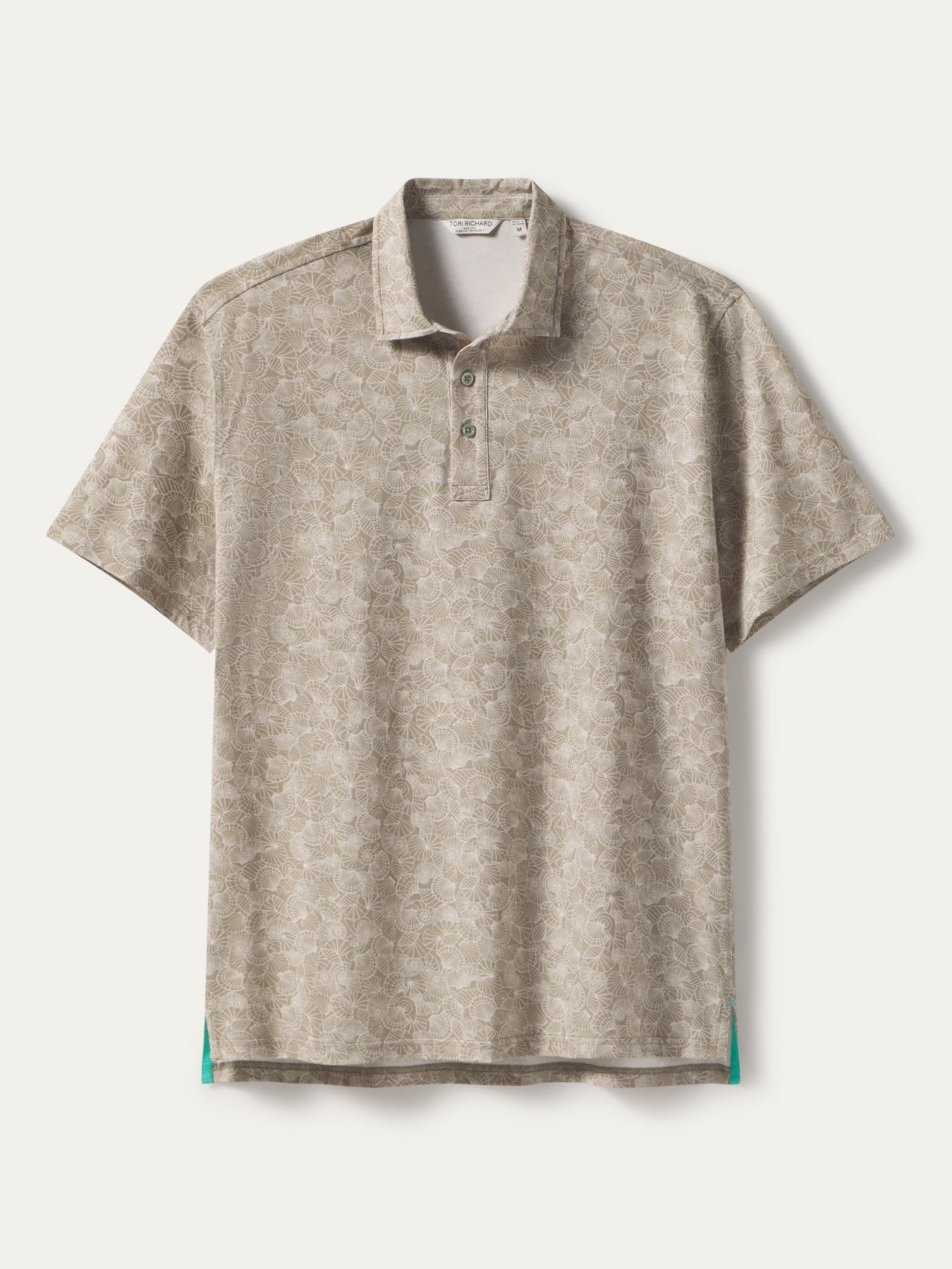 Beige floral-pattern polo with teal-accented side hems, front view shown in both images.