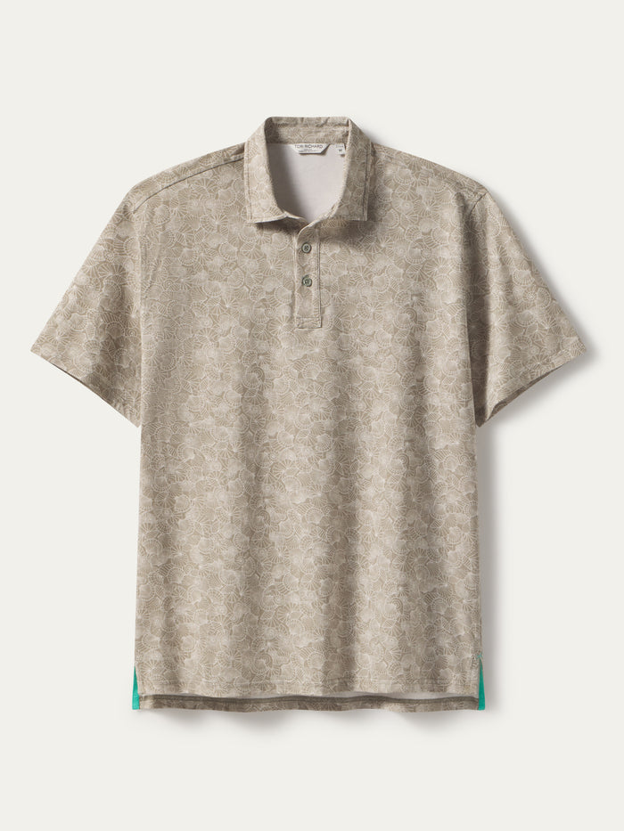 Beige floral-pattern polo with teal-accented side hems, front view shown in both images.