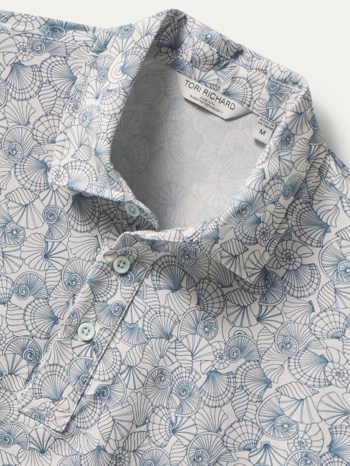 Blue and white seashell-print polo shirt with three buttons, front view shown in both images.