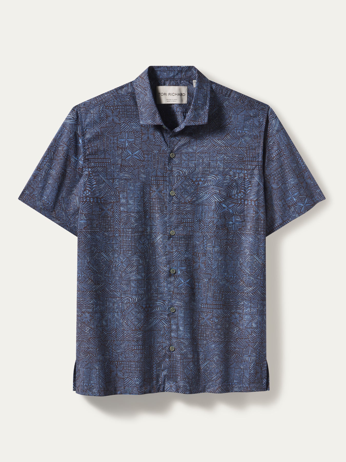 Blue geometric-print short-sleeve button-up shirt, front view on white background.