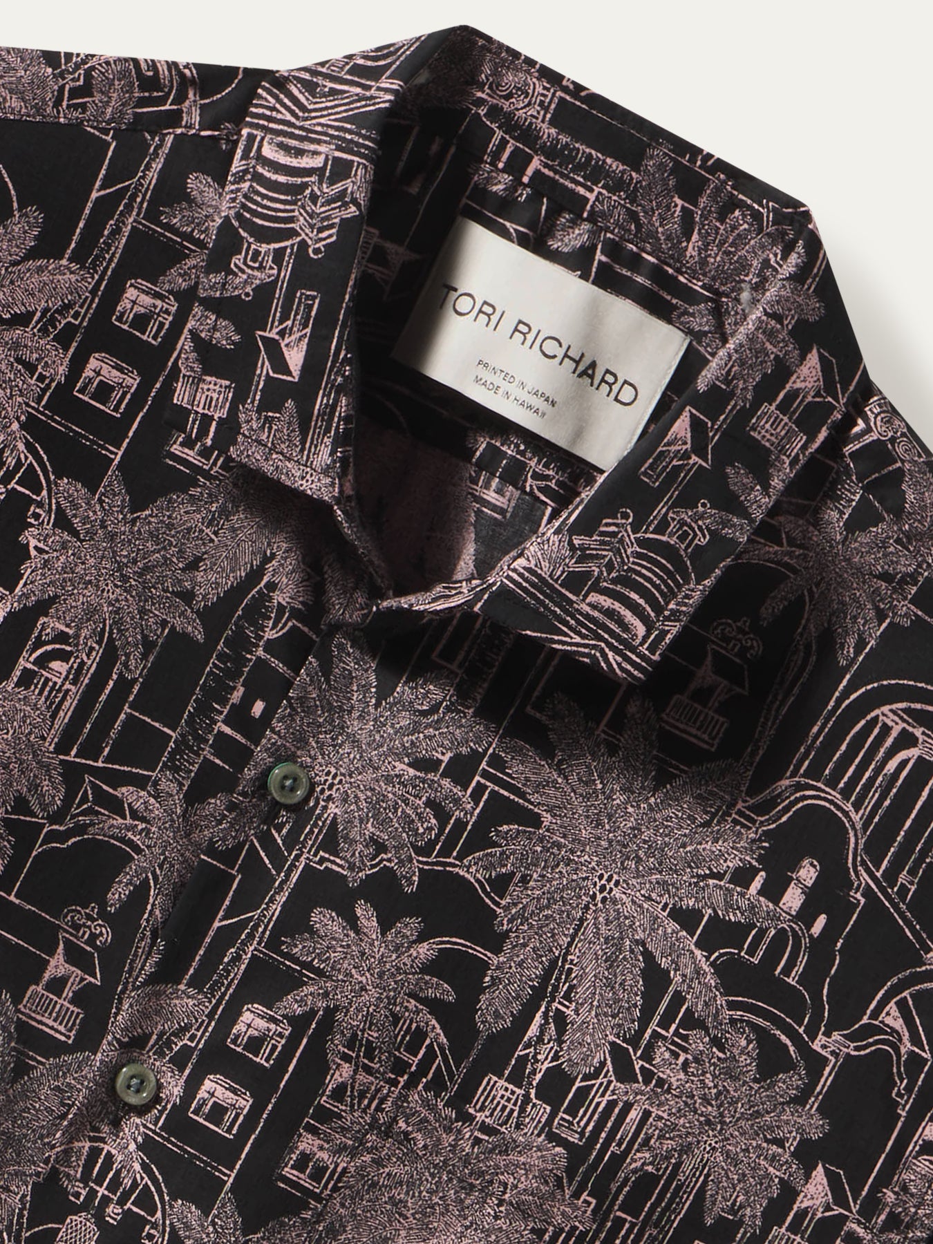 Black shirt with pink tropical and architectural print, cotton lawn; front and back views shown.