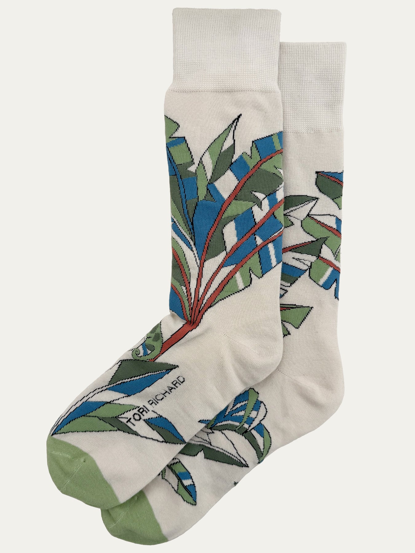Off-white and blue/green tropical-print Hidden Figures socks, side view{{/AltText}}.