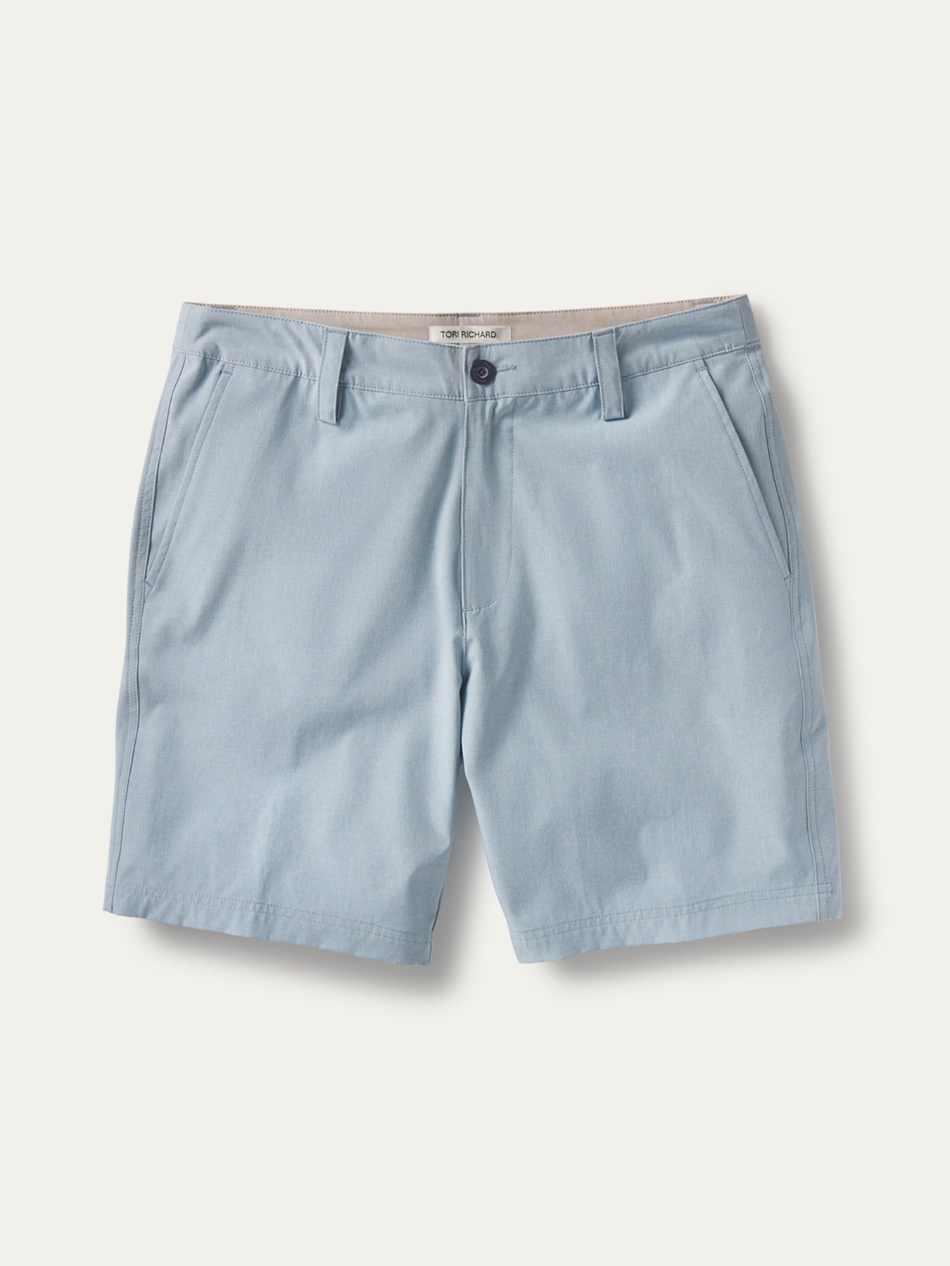 Light blue performance shorts, front view with belt loops, button closure, and front pockets.