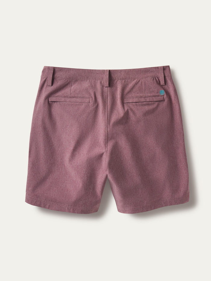 Mauve solid performance shorts, back view with welt pockets and belt loops on white{{/AltText}}.