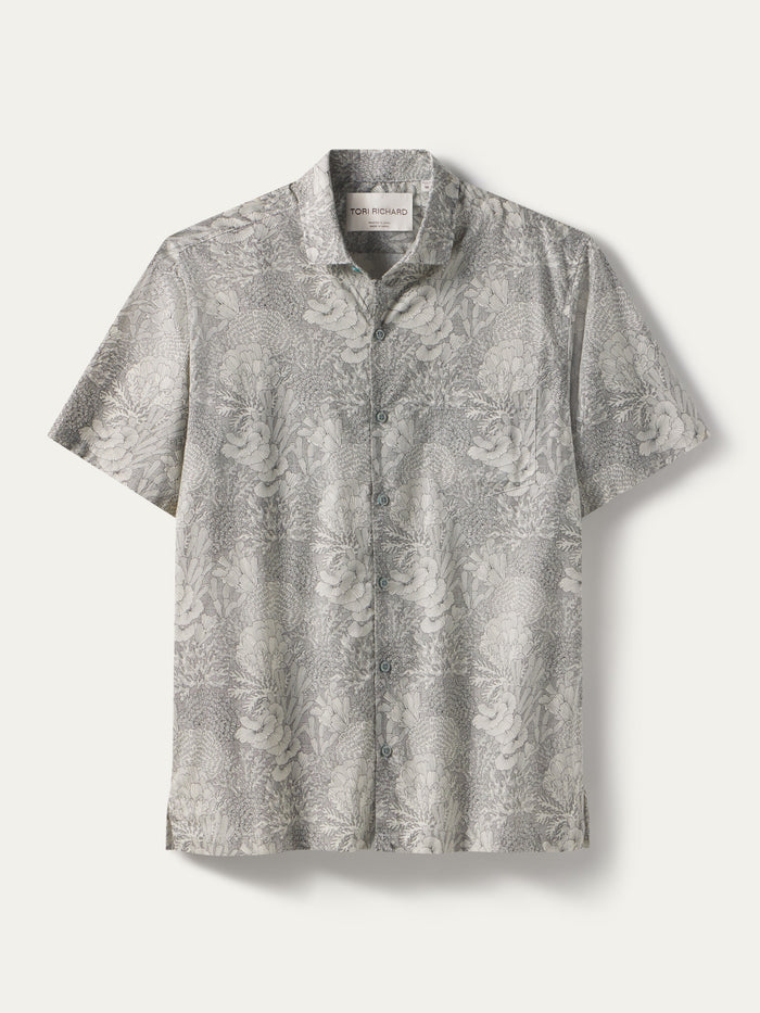 Light gray floral-print short-sleeve shirt, flat lay on plain background.