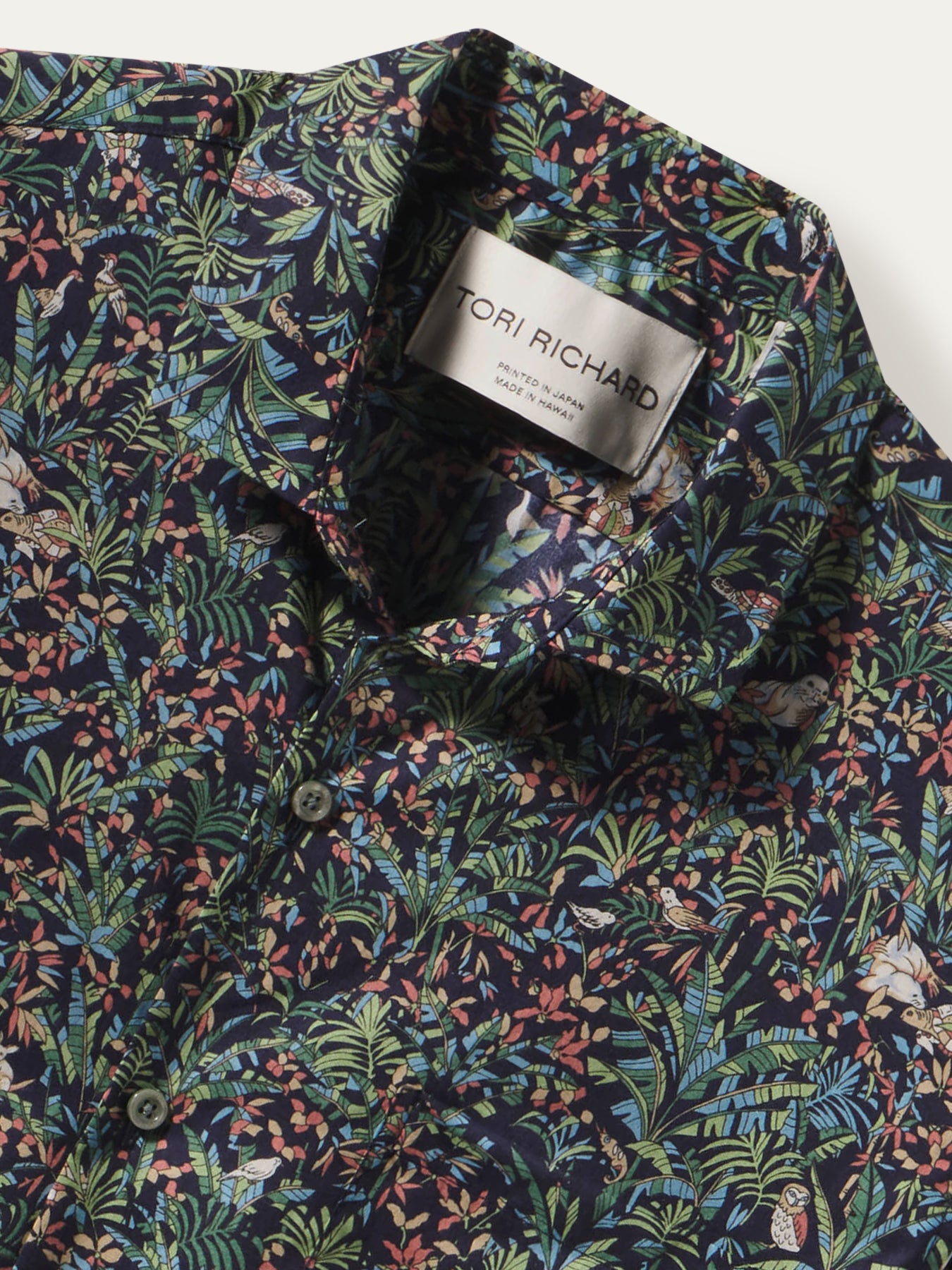 Navy tropical floral-print short-sleeve shirt, Tori Richard label on collar, front view shown.