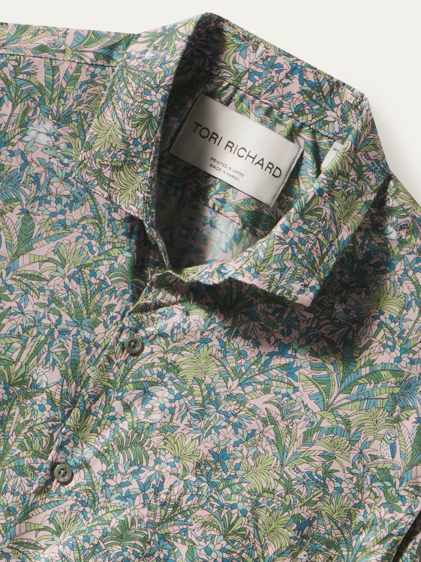 Pink, blue, and green tropical leaf-print cotton shirt shown with close-up of Tori Richard label.