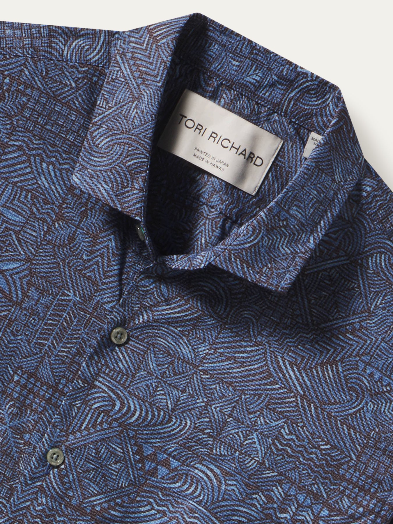 Blue Pacific Islander tapa-print collared shirt with button front and Tori Richard label, front view.