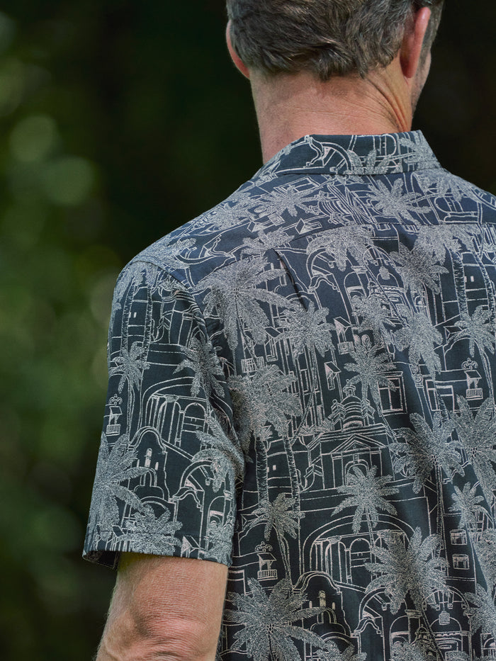Dark gray palm tree and architectural print Royal Stay short-sleeve shirt, back view{{/AltText}}.
