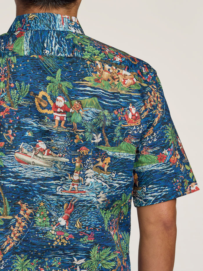 Front view: Red tropical Santa and Christmas-print Hawaiian shirt. Back view: Same holiday shirt.