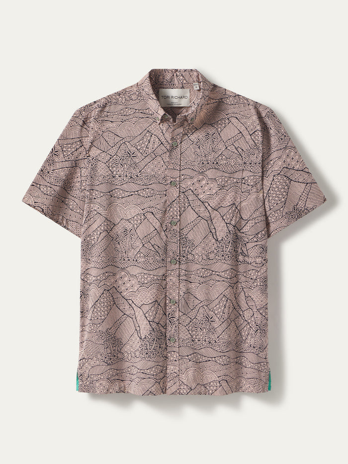 Light brown short-sleeve shirt with black mountain forest tapa pattern, front view; tapa-print shirt, front view.
