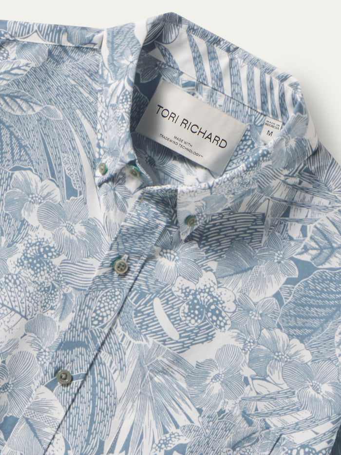 Blue and white floral button-down shirt with greenish buttons, front view shown in both images.