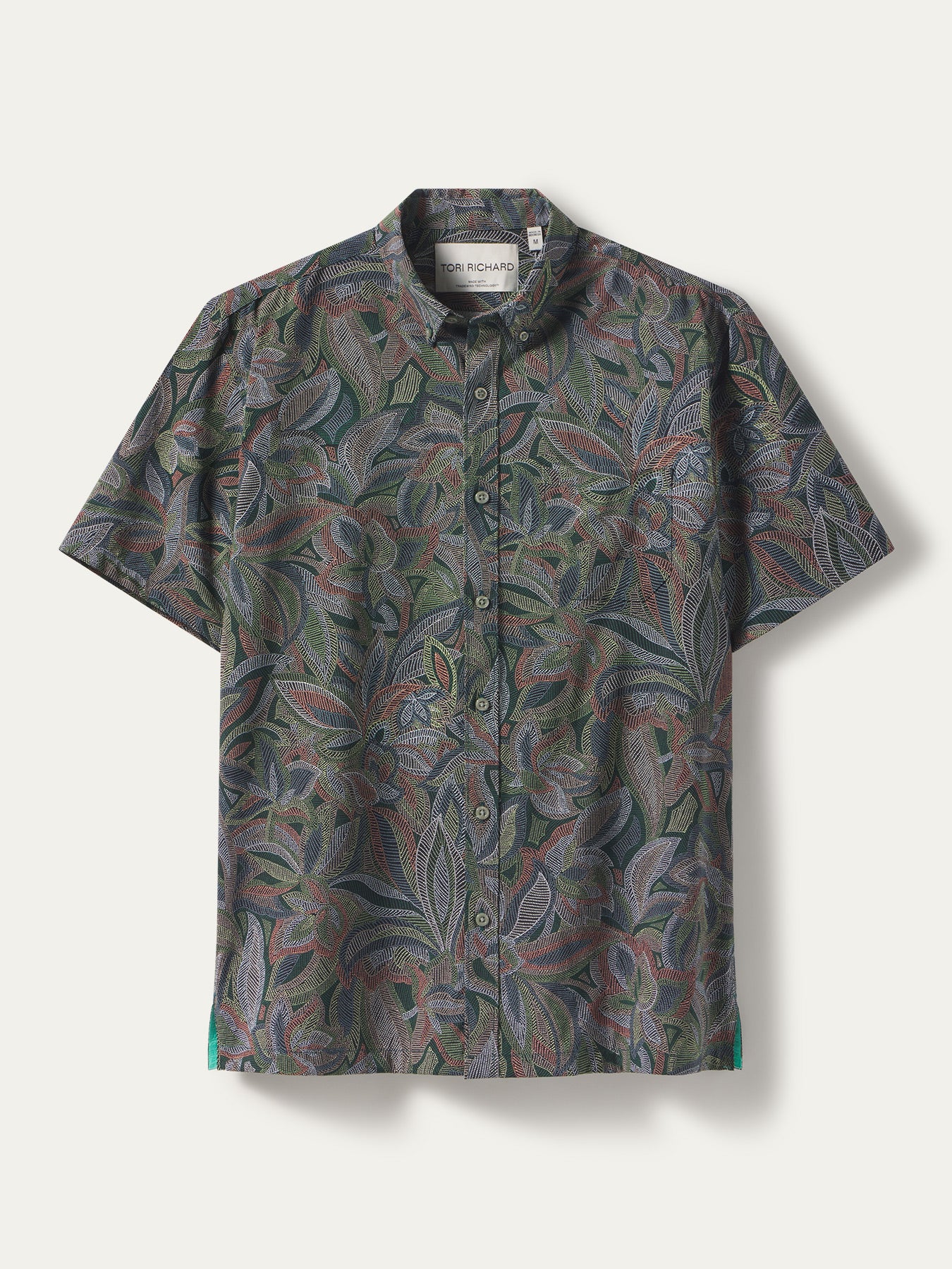 Multicolor leaf-print short-sleeve shirt with moisture-wicking fabric, front view.