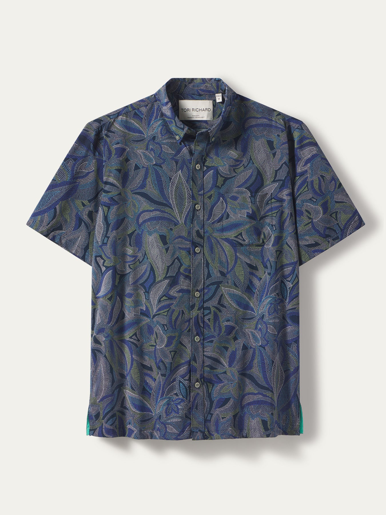 Blue and white dot-pattern short-sleeve shirt, moisture-wicking fabric, front view shown in both images.
