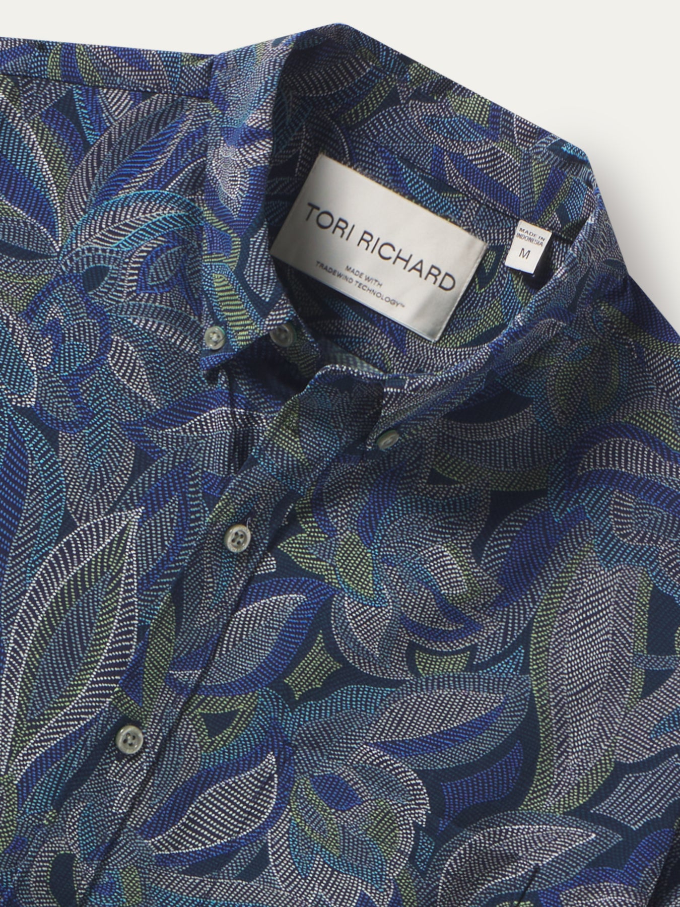 Blue, green, and white leaf-pattern short-sleeve shirt, front view (shown in images 1 and 2).
