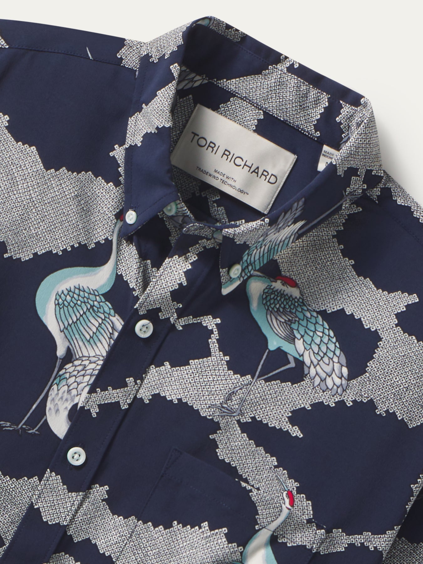 Navy crane and cloud print long-sleeve shirt, front and angled views with vintage artwork details.