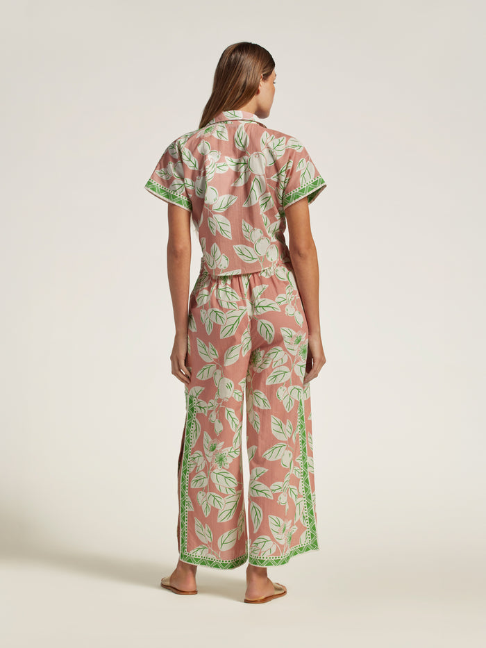 Pink and green leaf-print cotton voile pull-on pants, rear view.