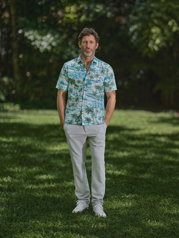 Light gray Lanai Pant – Tradewind Technology and blue and white palm print shirt, front view.{{/AltText}}.