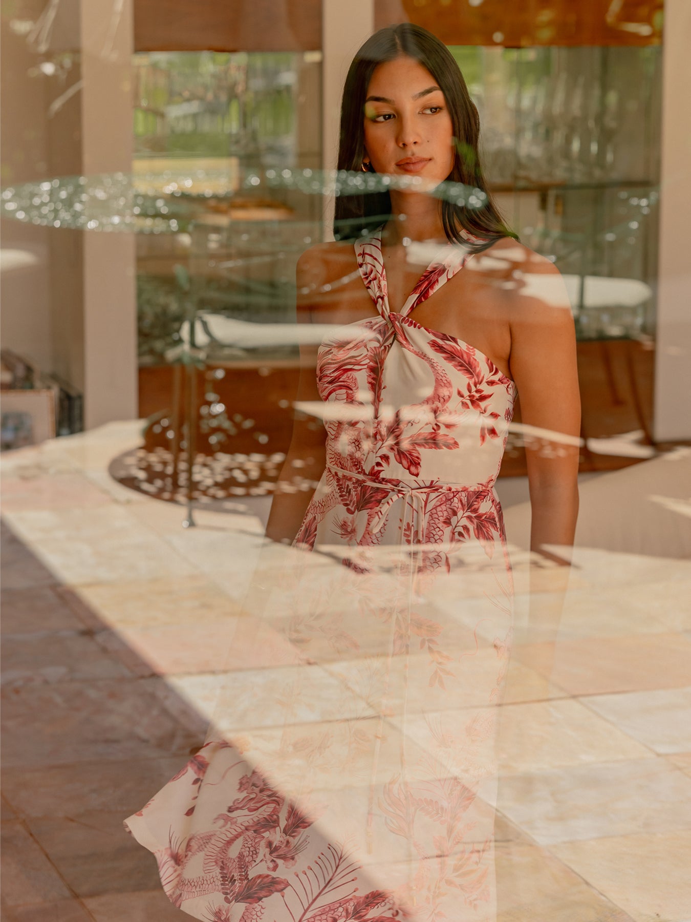 Pink floral-print midi dress seen indoors through a window with sunlight reflections (Images 1 & 2).