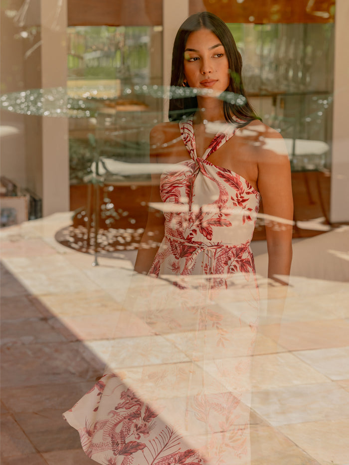 Pink floral-print midi dress seen indoors through a window with sunlight reflections (Images 1 & 2).