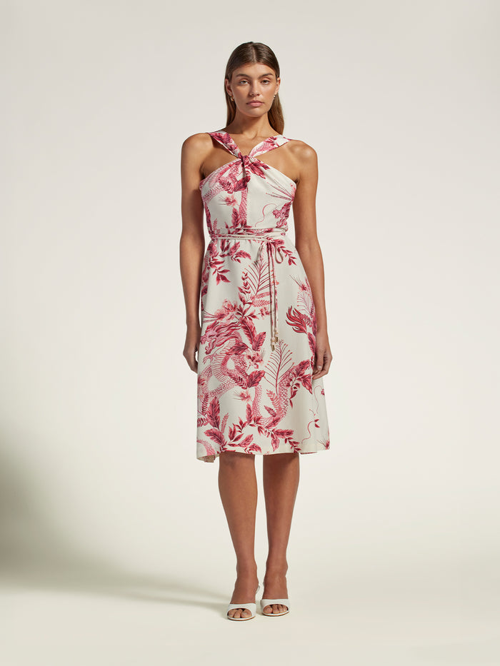 Pink floral halter-neck dress, full-body view, white sandals shown in both images.