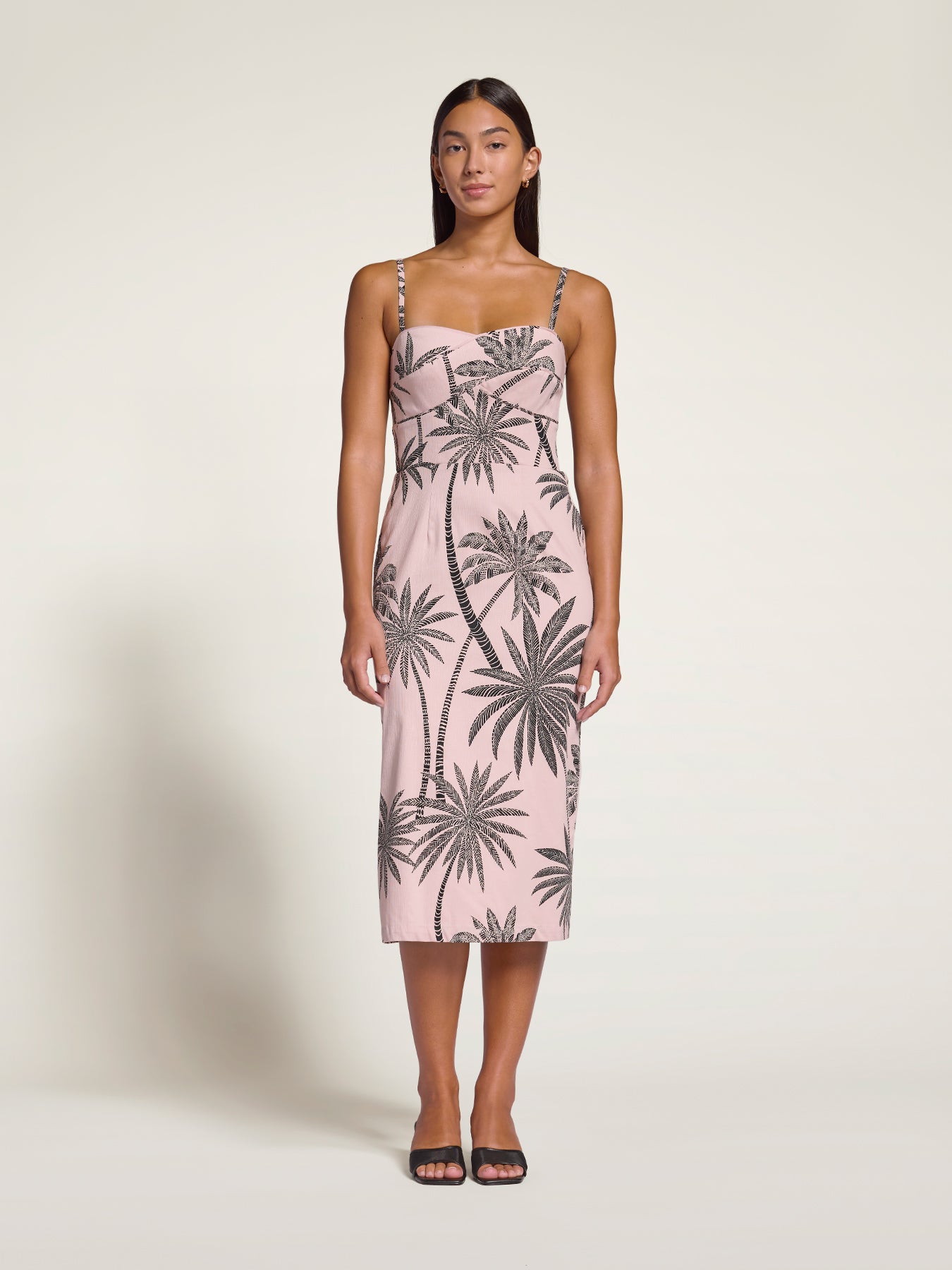 White coconut palm-print sleeveless dress with spaghetti straps, front view.