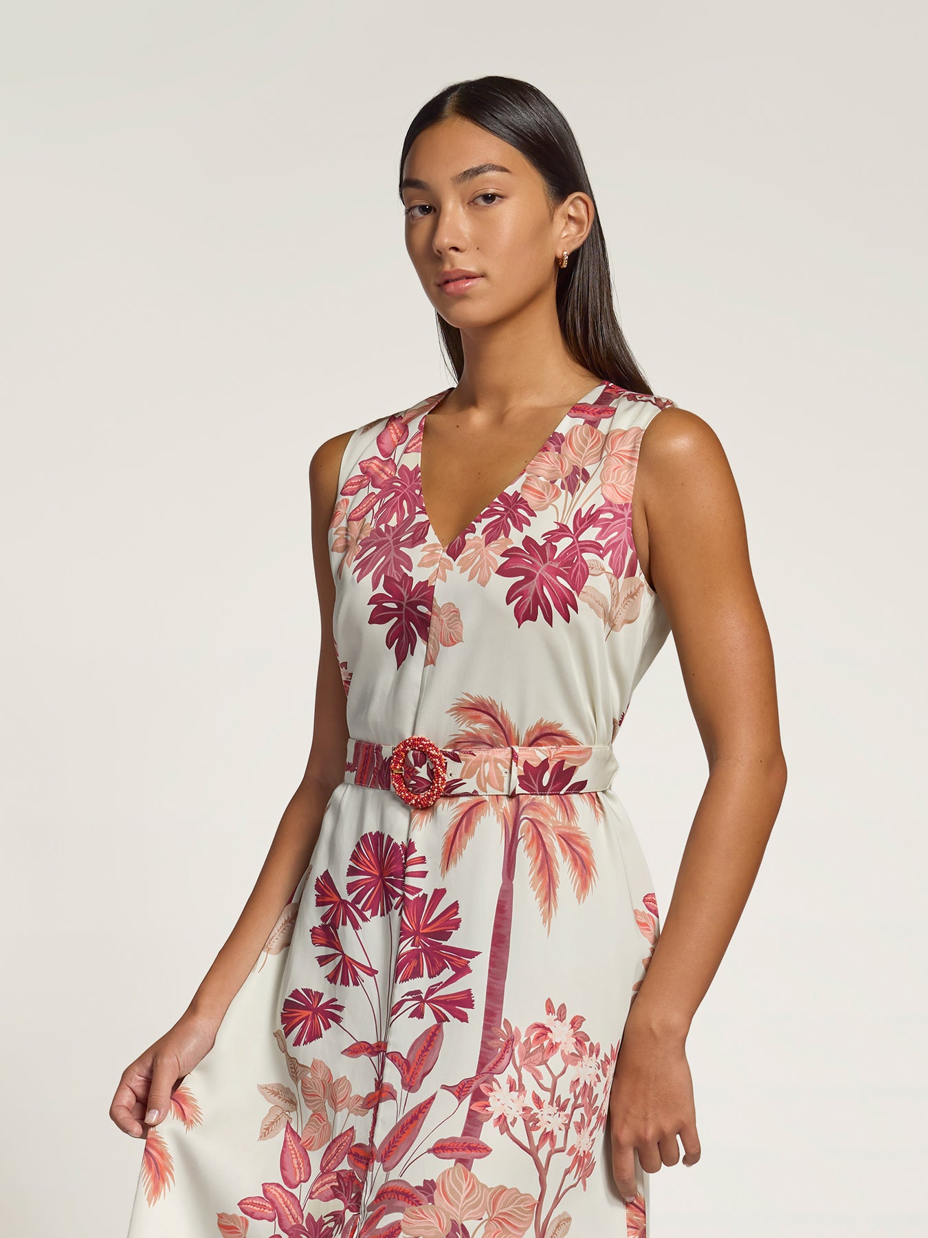 Yellow floral sleeveless maxi dress with beaded buckle, full front view against plain backdrop.