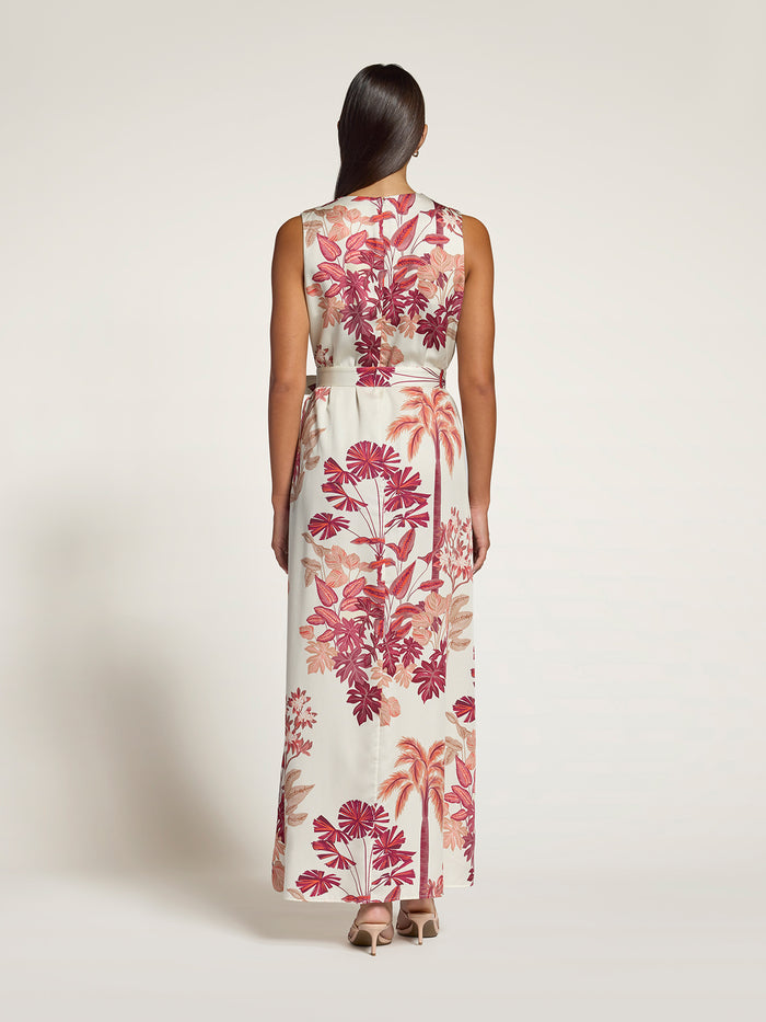 Golden hour pink floral and palm leaf print sleeveless maxi dress, back view.
