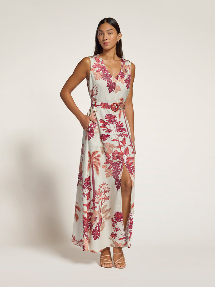 Golden yellow floral print sleeveless maxi dress with belted waist and thigh-high slit, front view.