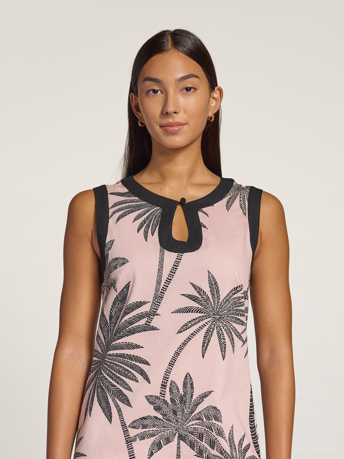 Pink and black palm-print sleeveless dress, full front view against a plain light background.