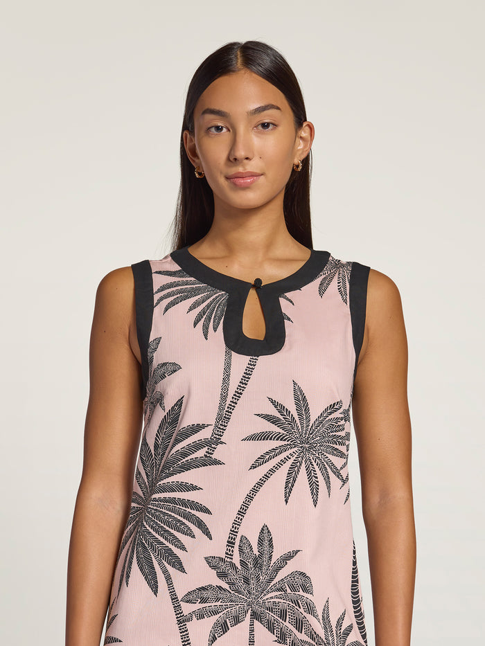 Pink and black palm-print sleeveless dress, full front view against a plain light background.
