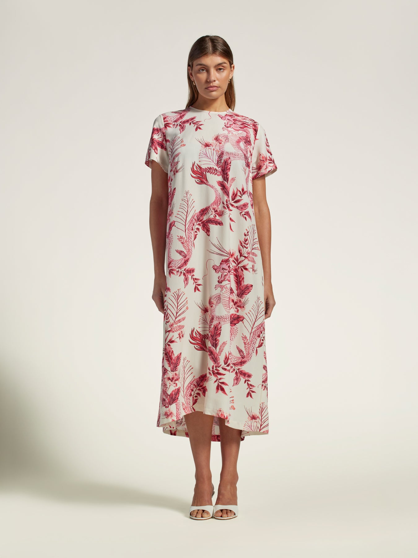 White short-sleeve midi dress with red floral print, front view against plain background{{/AltText}}.