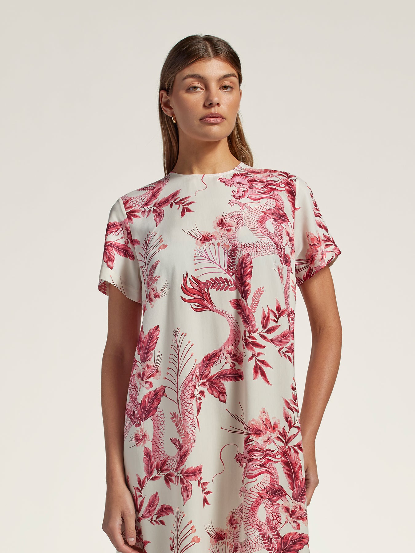 Black dress with Japanese dragon and floral print, full front view in both images.