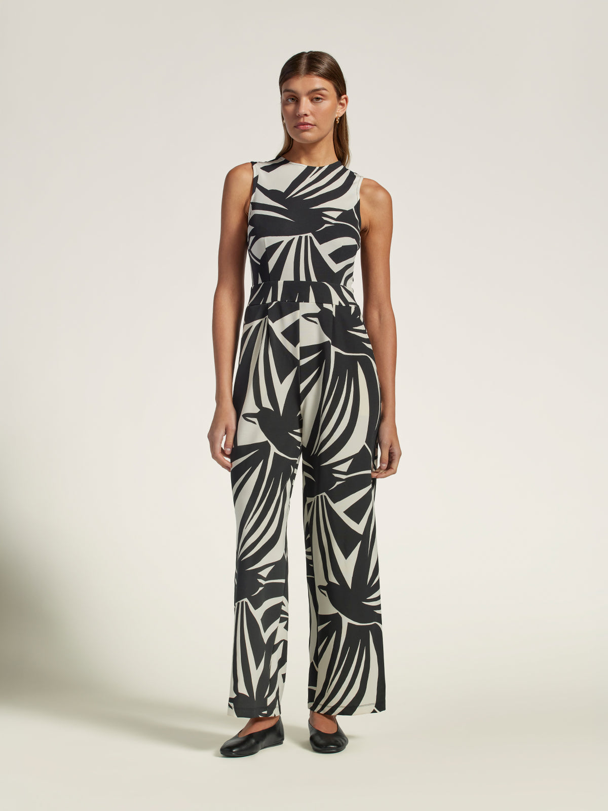 Multicolor geometric-print wide-leg jumpsuit, full-body view with black shoes.