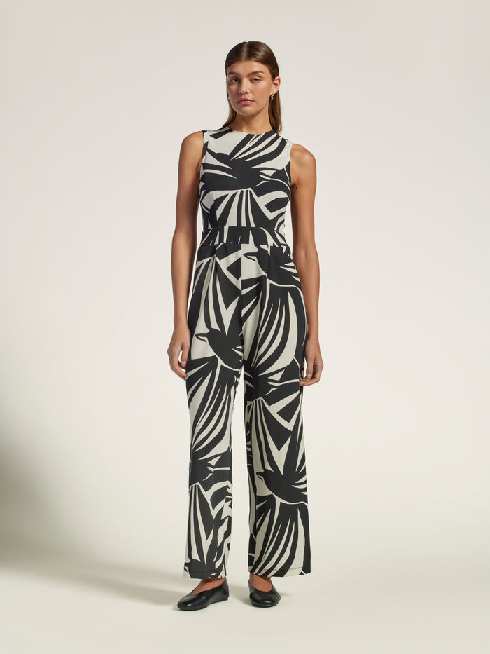 Multicolor geometric-print wide-leg jumpsuit, full-body view with black shoes.