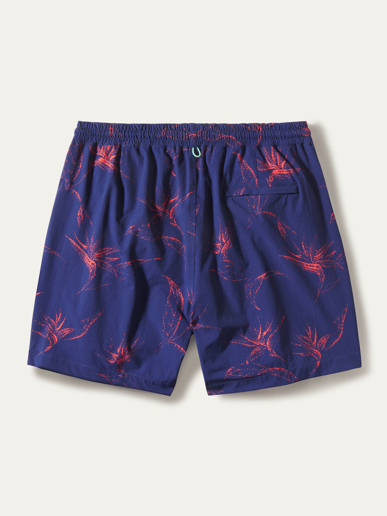 Blue swim shorts with red bird of paradise print, elastic waist, back pocket, shown flat in both images.