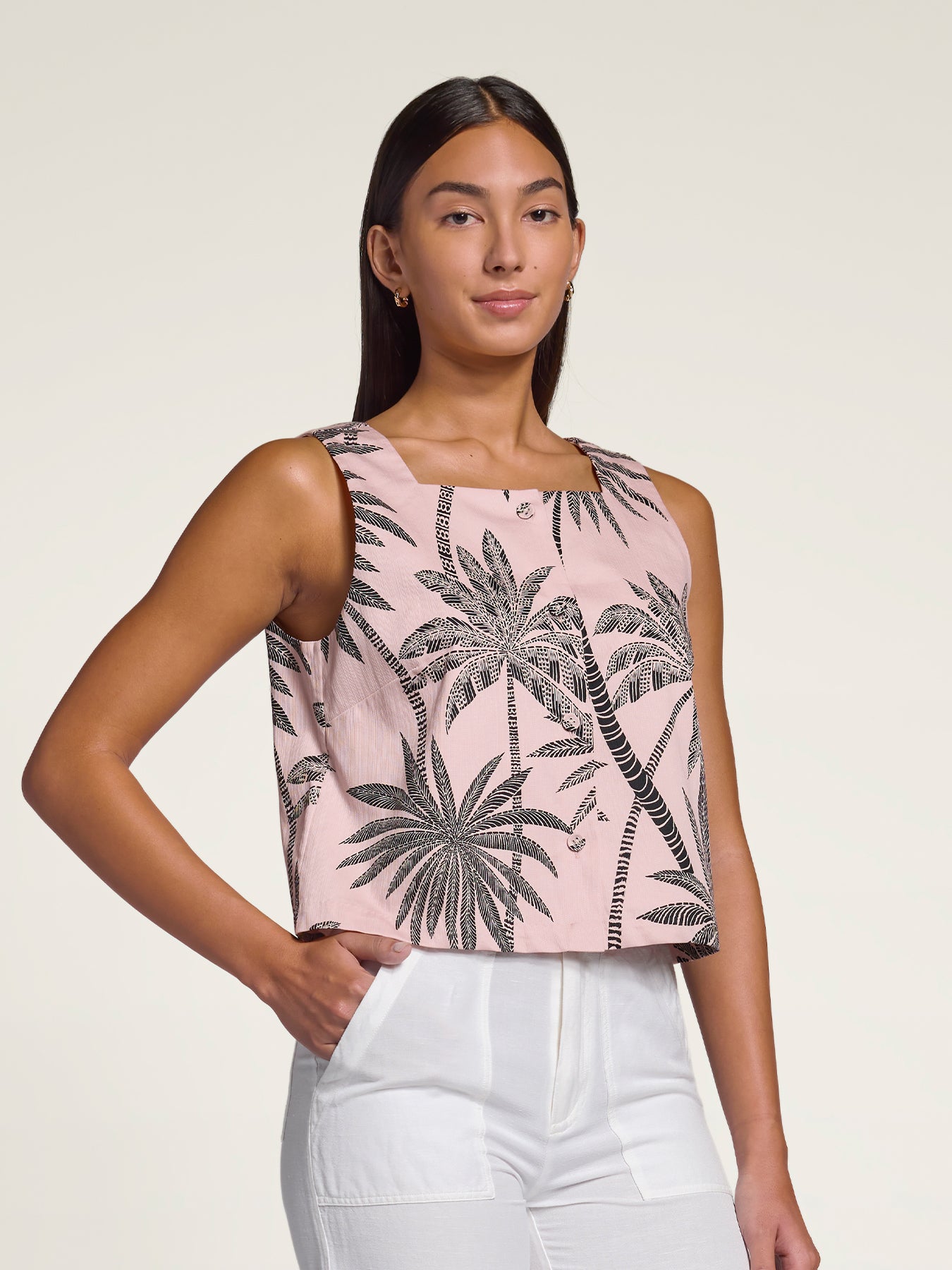 Multicolor vintage-print sleeveless cropped top with white pants, front view shown in both images.