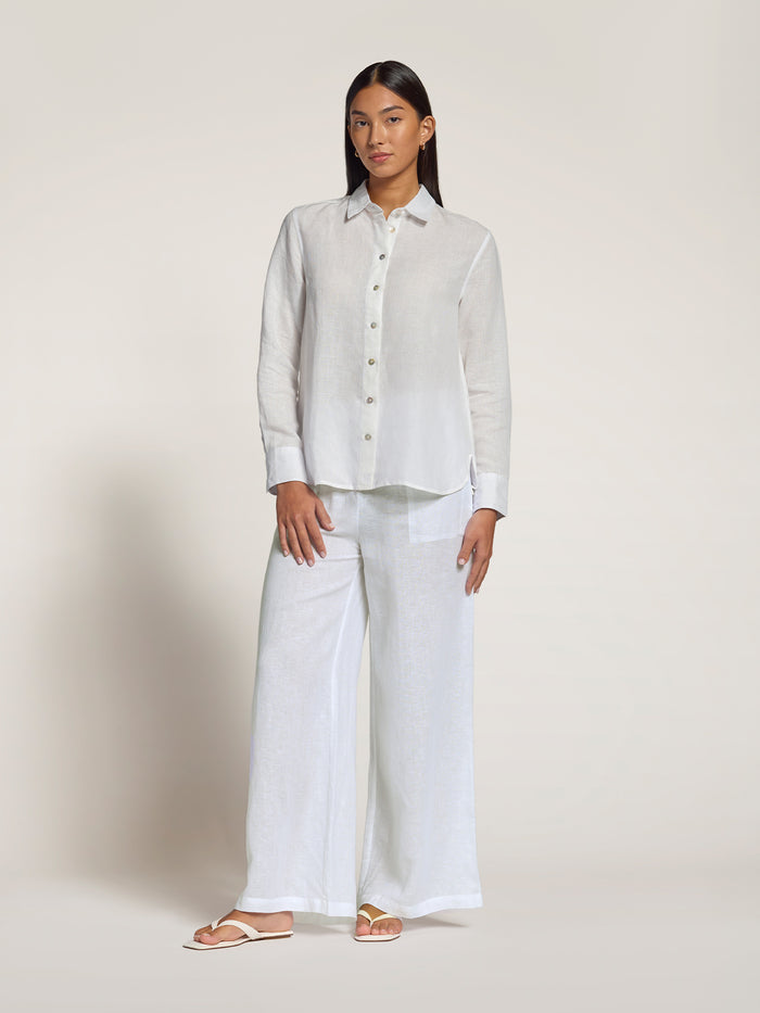 White linen long-sleeve top with matching wide-leg pants, full outfit, front view.
