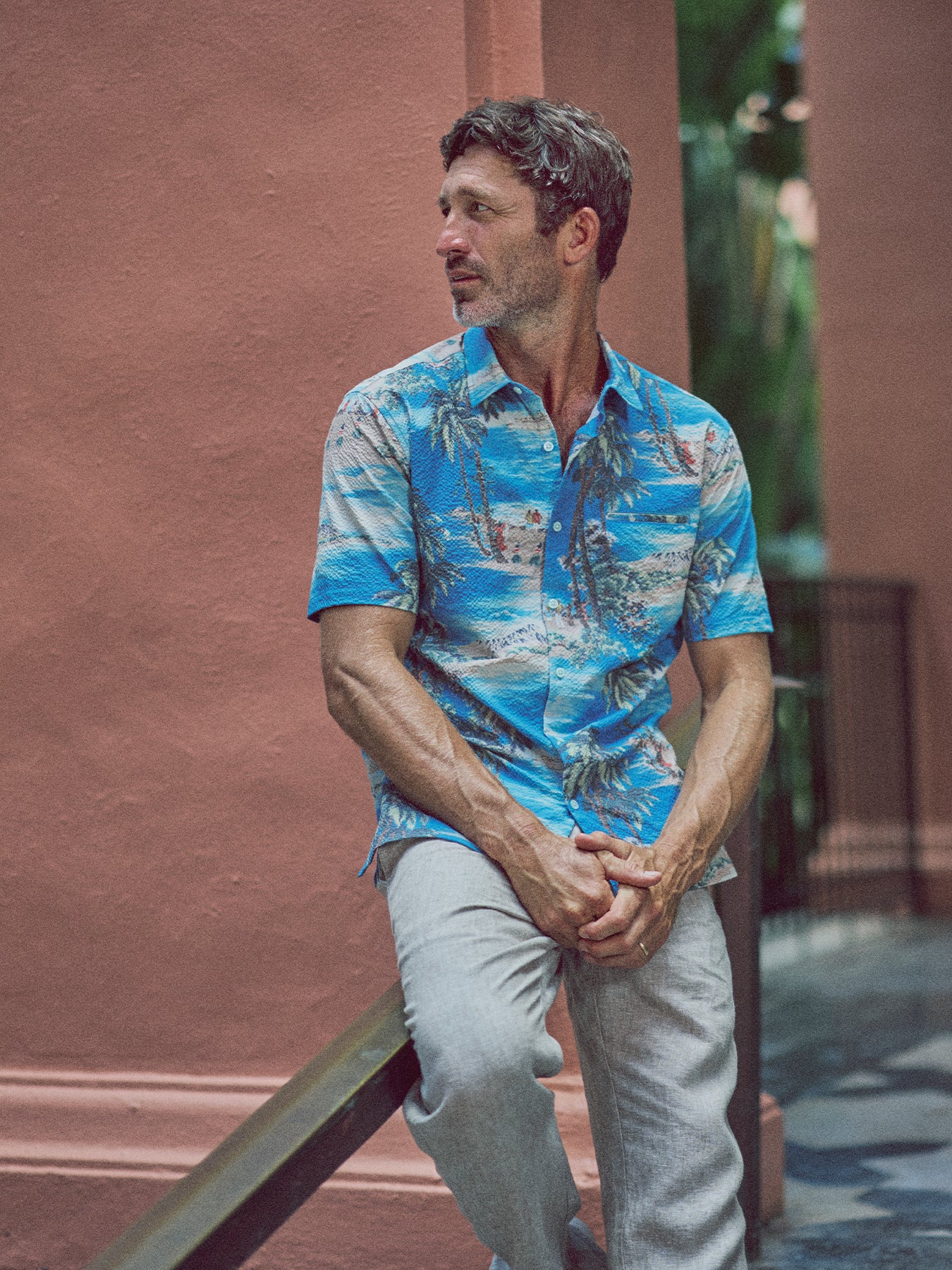 Blue and white tropical-print Bon Voyage Tradewind Technology short-sleeve button-up shirt, front view.{{/AltText}}.