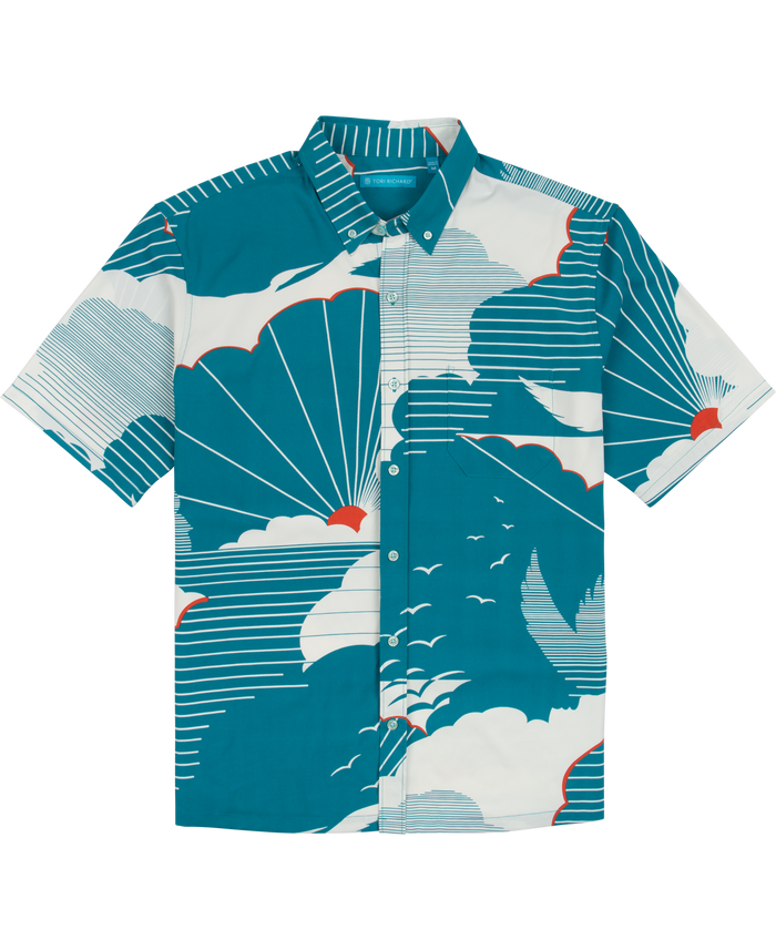 Blue shirt with white cloud and bird print, red sun accents, moisture-wicking fabric.
